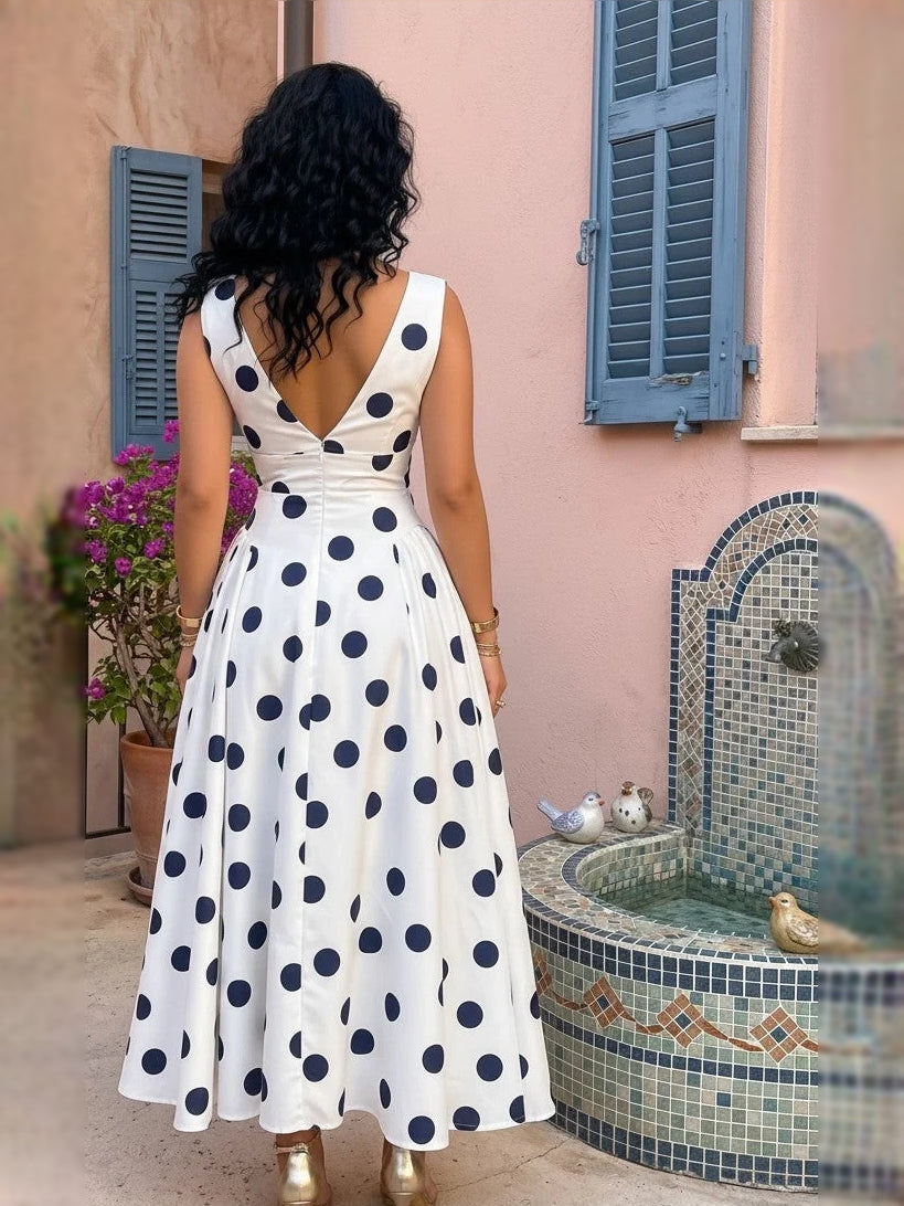 Back view white satin V-neck A-line midi dress with navy polka dots, sleeveless