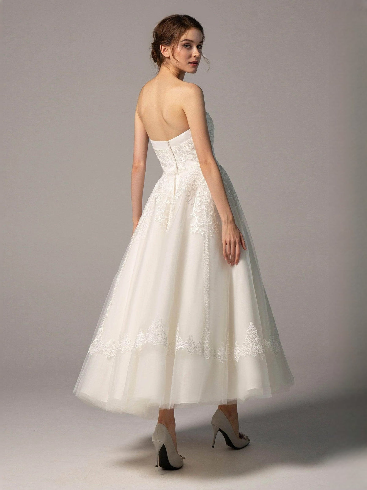 Ivory strapless A-line short wedding dress with lace overlay and sheer back detail