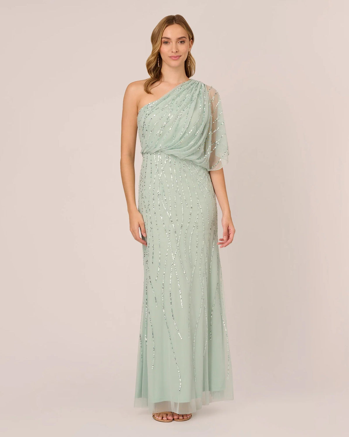 Mint green one-shoulder draped maxi dress with sparkling sequin details and sheer sleeve