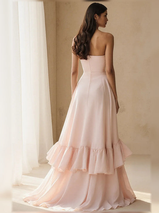 Strapless tiered ruffle A-line formal dress in light pink chiffon, back/side view