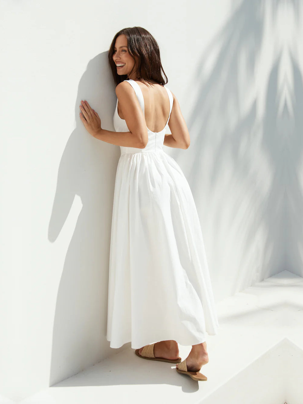 White a-line maxi formal dress with a-line, full-length back view