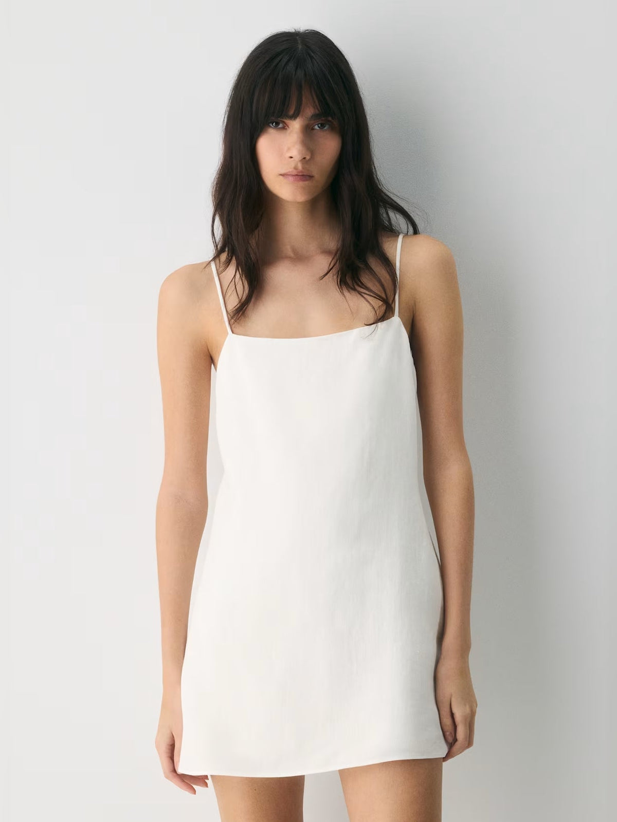 White square-neck mini dress with spaghetti straps, close front view