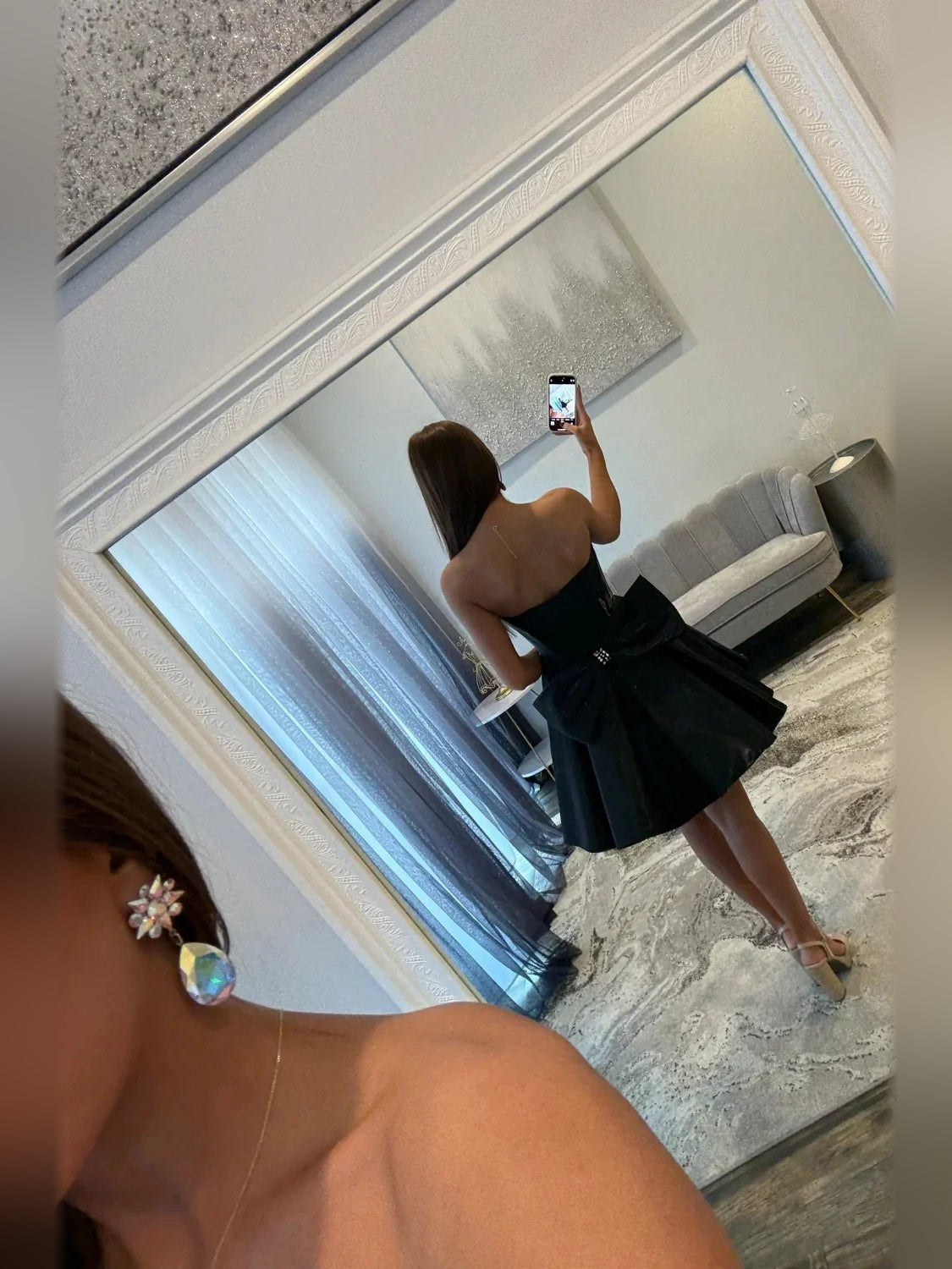 Black corset sweetheart A-line satin dress, back view with bow detail