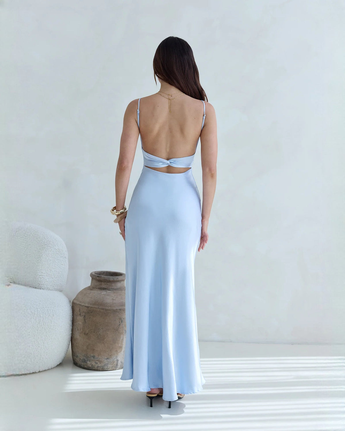 Light blue satin maxi bridesmaid dress with open back and thin shoulder straps