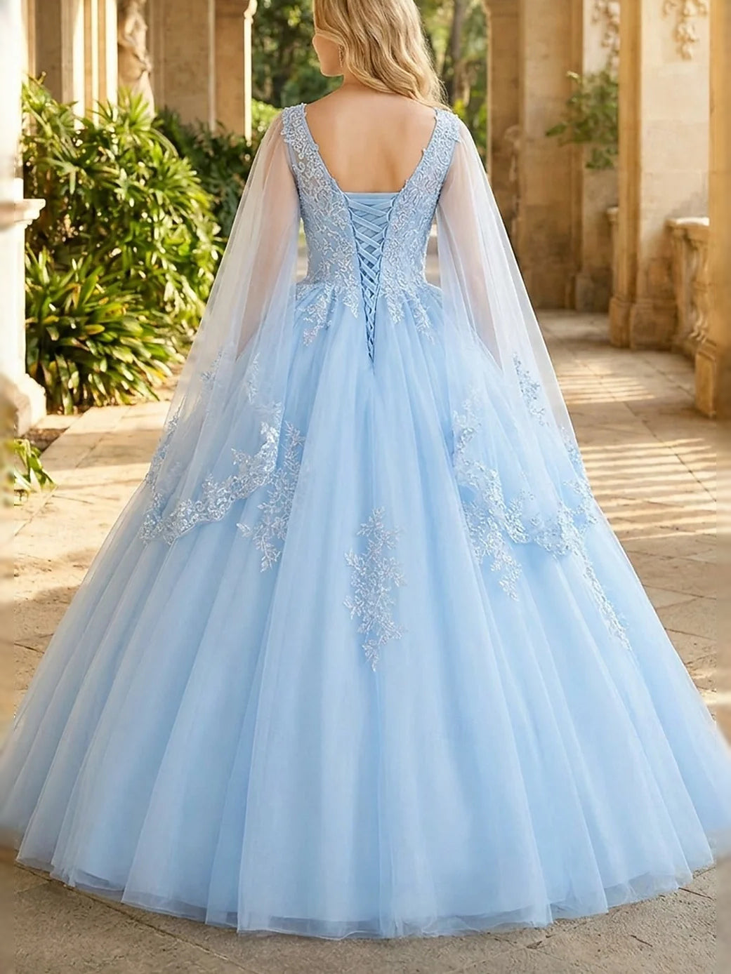 Sky blue corset-style prom dress, floral back detailing, V-neck, tulle ball gown skirt
