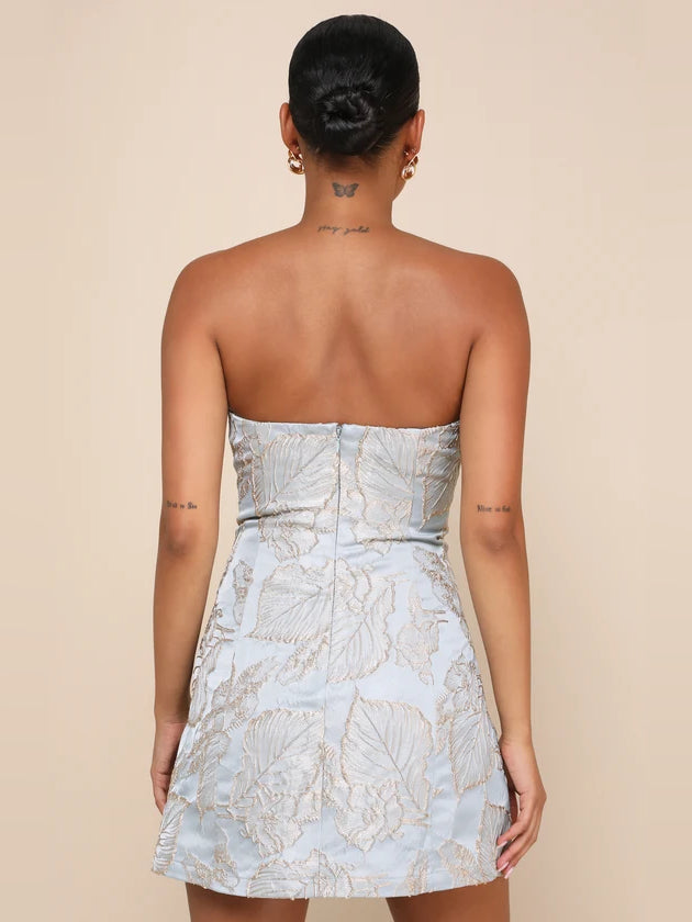 Back view slate blue strapless mini homecoming dress with gold floral print