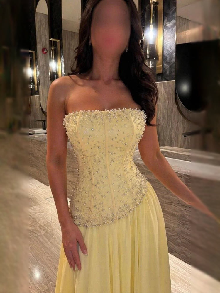 Pale yellow strapless corset formal dress with floral beaded bodice front, full length