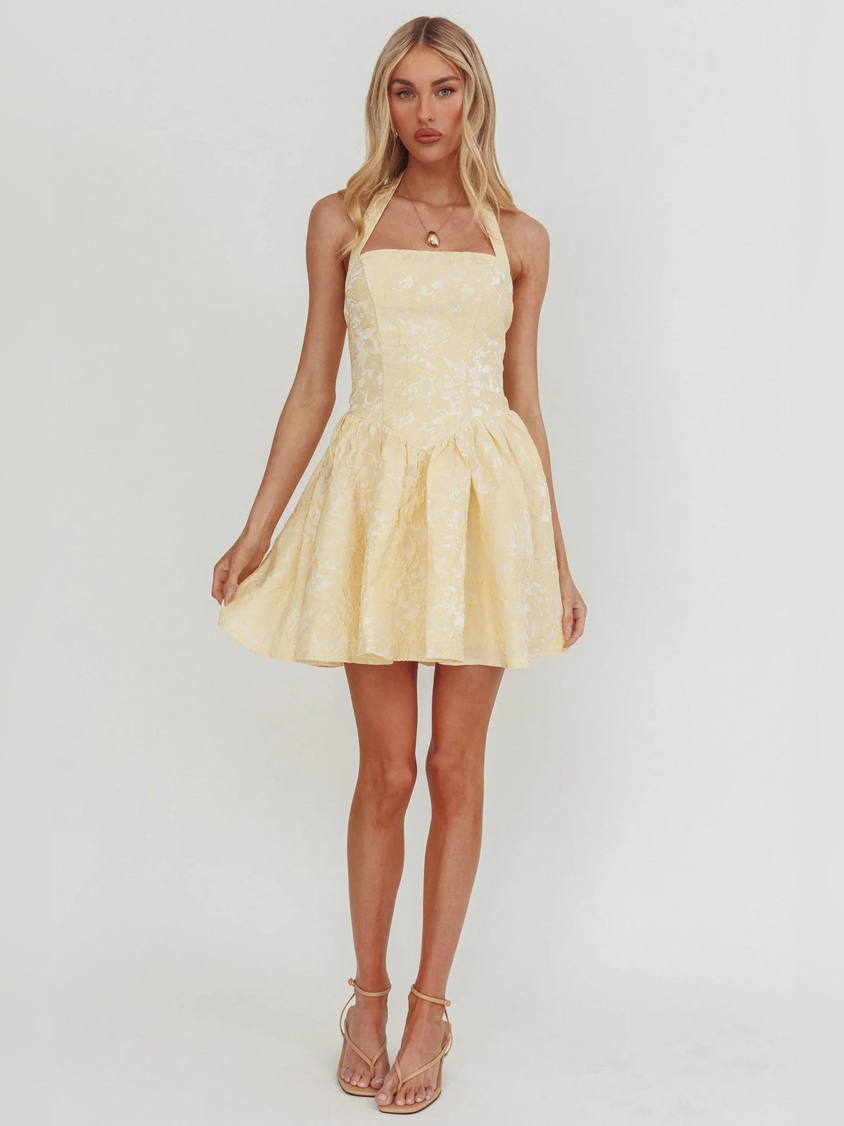 Butter halter mini dress with square neckline, fitted bodice, flared layered skirt