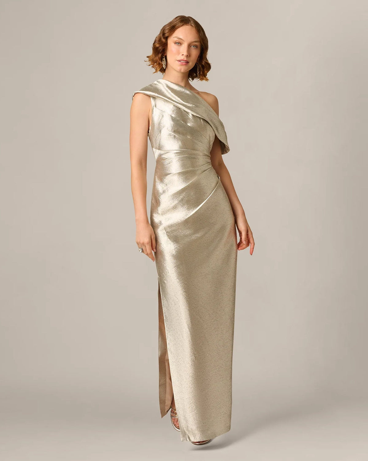 Light gold metallic one-shoulder maxi dress with draped overlay and side slit