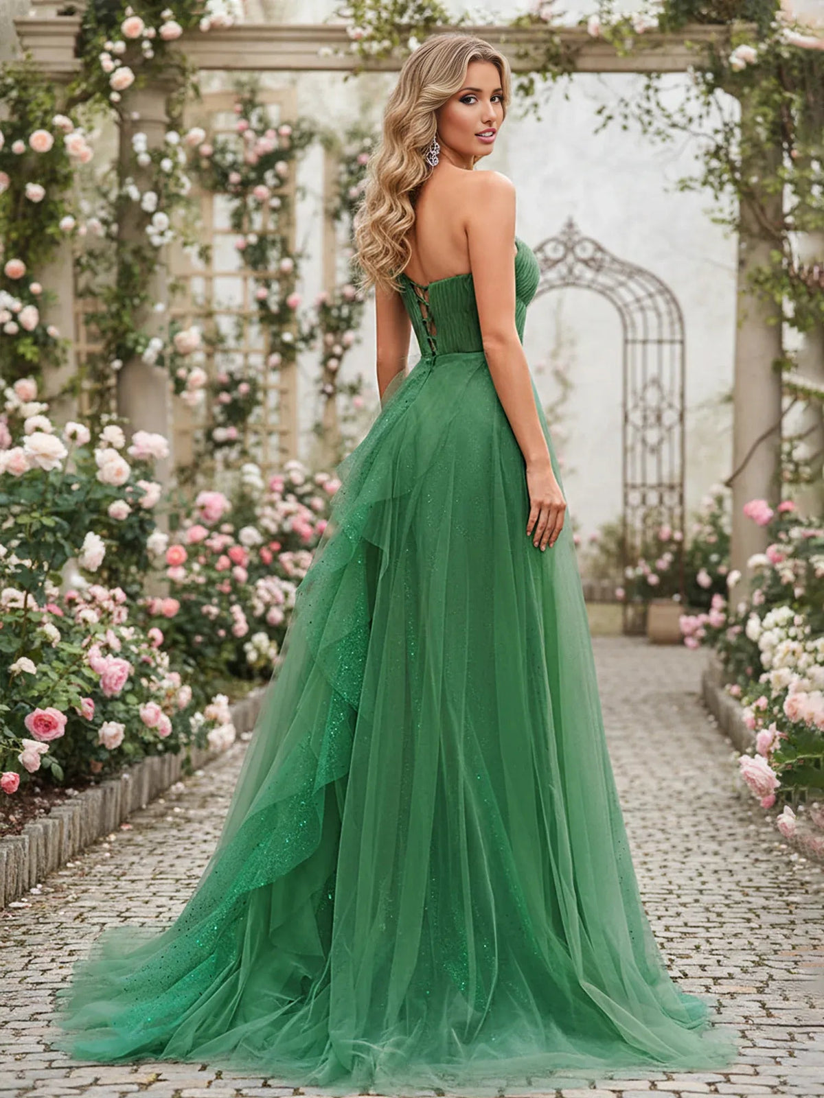Green one-shoulder corset formal dress with layered pleats and flowing floor-length skirt
