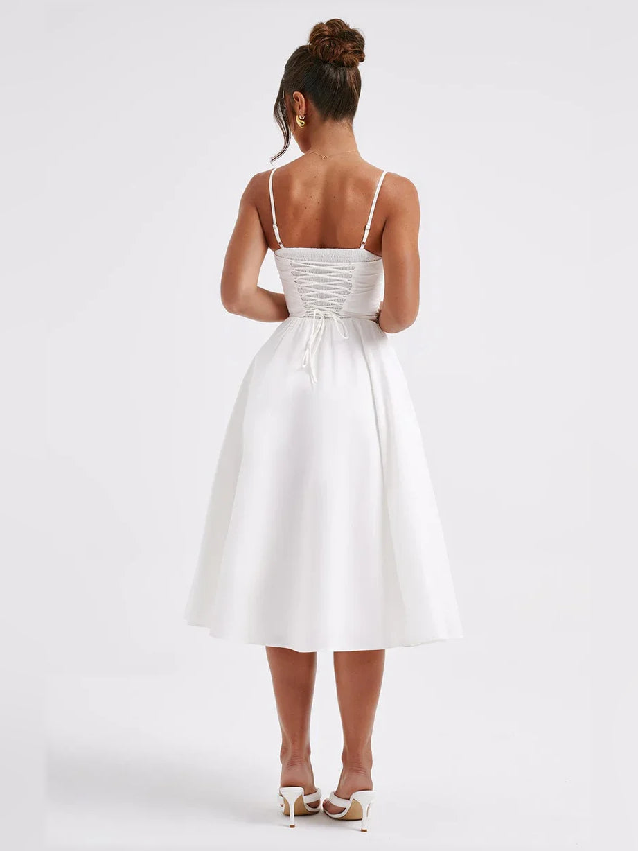 White A-line tea-length formal dress with corset-style bodice and spaghetti straps (back view)