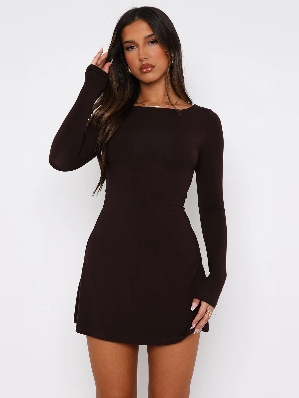 Chocolate long-sleeve mini dress with round neck, fitted silhouette, flared hem