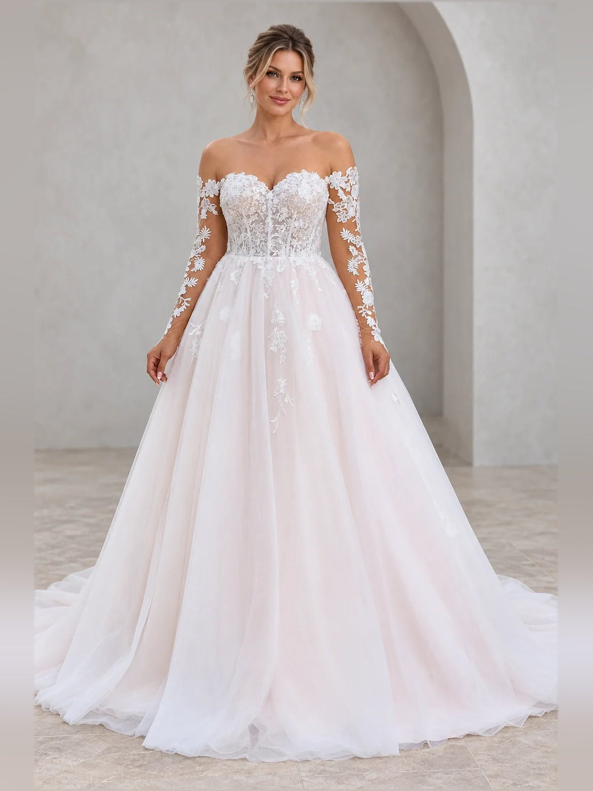 Ivory A-line tulle wedding dress with sweetheart neckline and floral lace bodice
