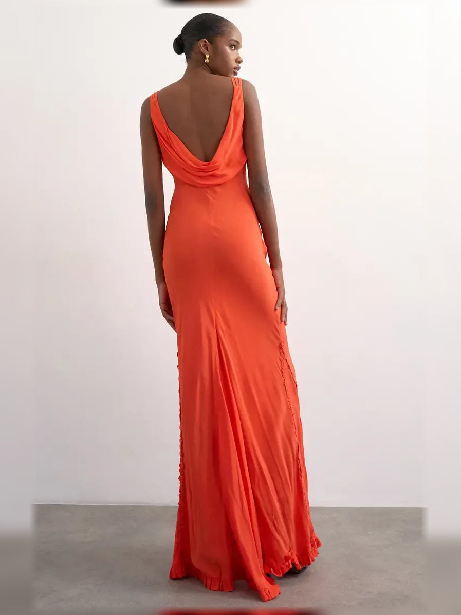 Orange V-neck spaghetti strap ruffle floor-length dress with open back drape detail.
