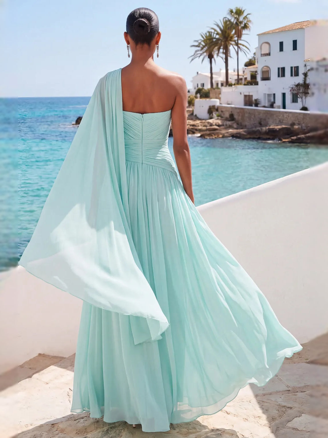 Mint green one-shoulder chiffon maxi dress, open back with draped overlay and flowy hem.
