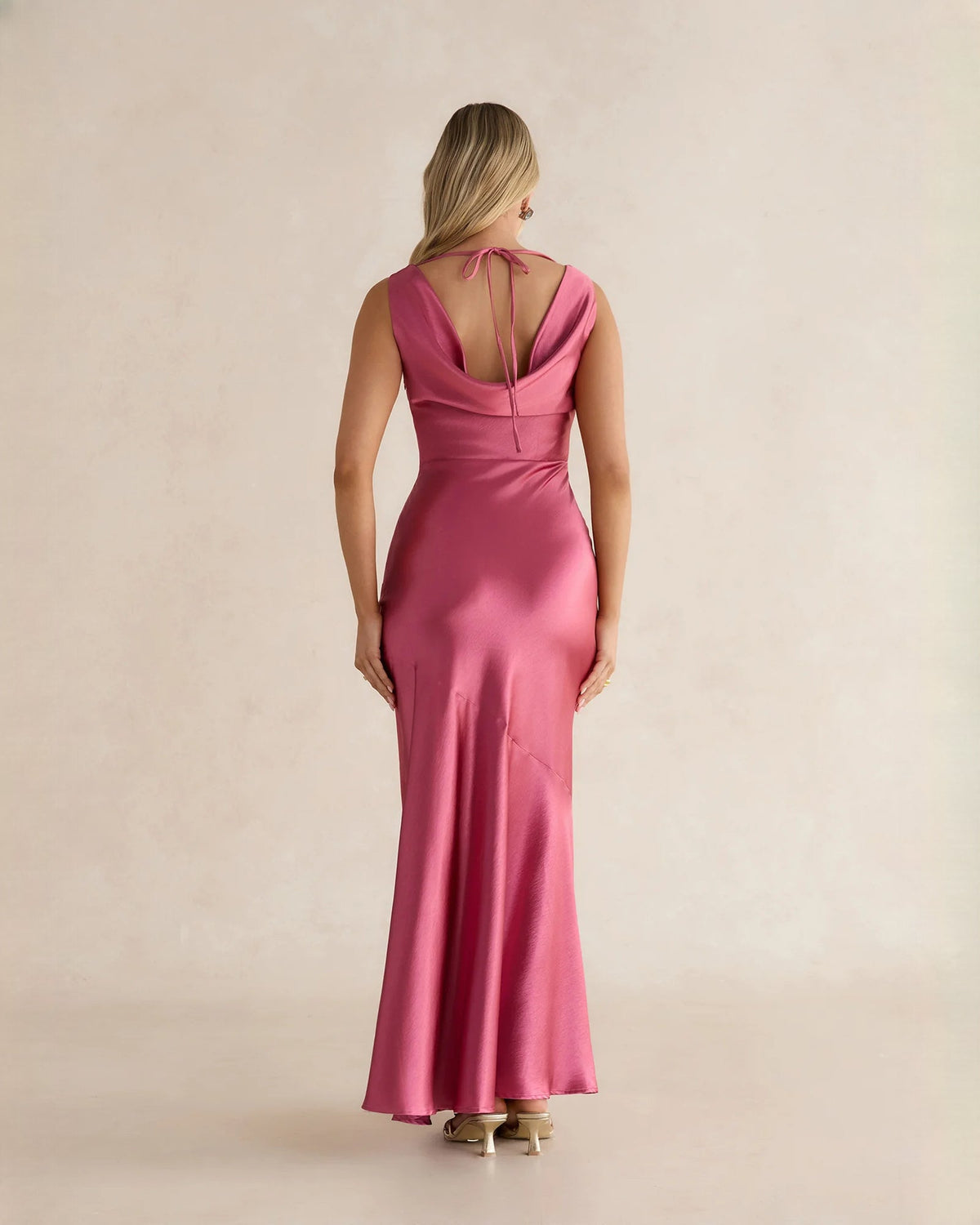Pink satin maxi dress, open back with thin tie straps and A-line silhouette