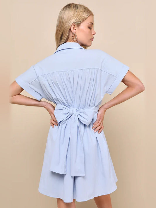 Light blue collared mini dress with short sleeves, knotted waist bow at back