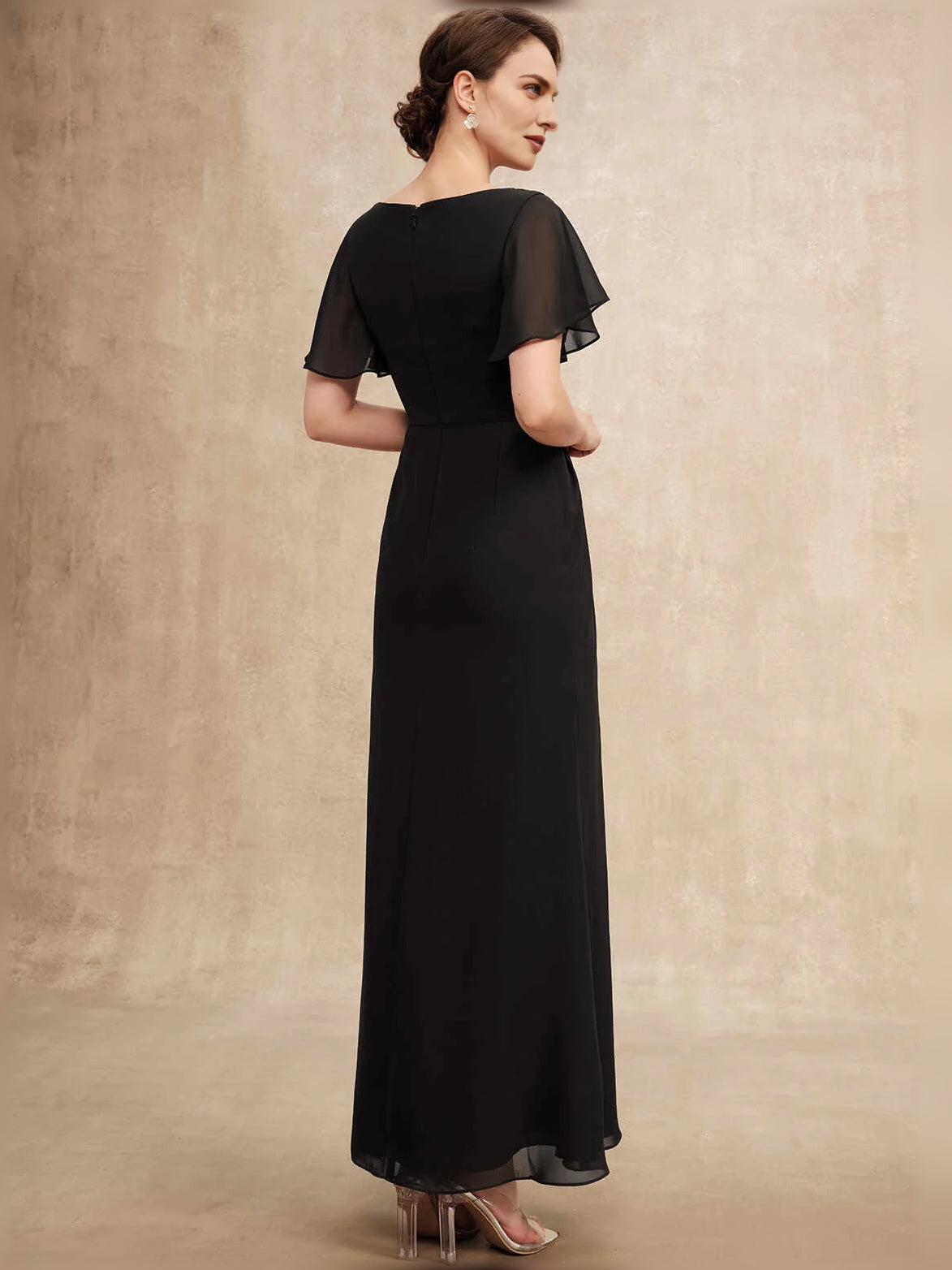 Black chiffon A-line maxi dress with flutter sleeves and draped back waist detail