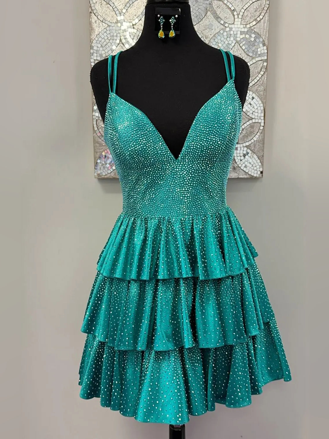 Turquoise glitter velvet V-neck short A-line dress with spaghetti straps and tiered ruffles.