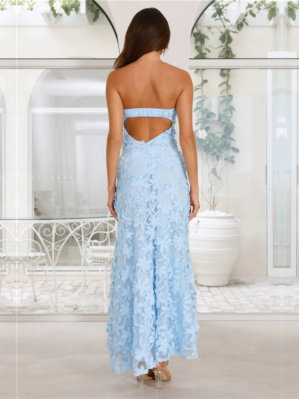 Blue sheath maxi formal dress with floral print, full-length back view