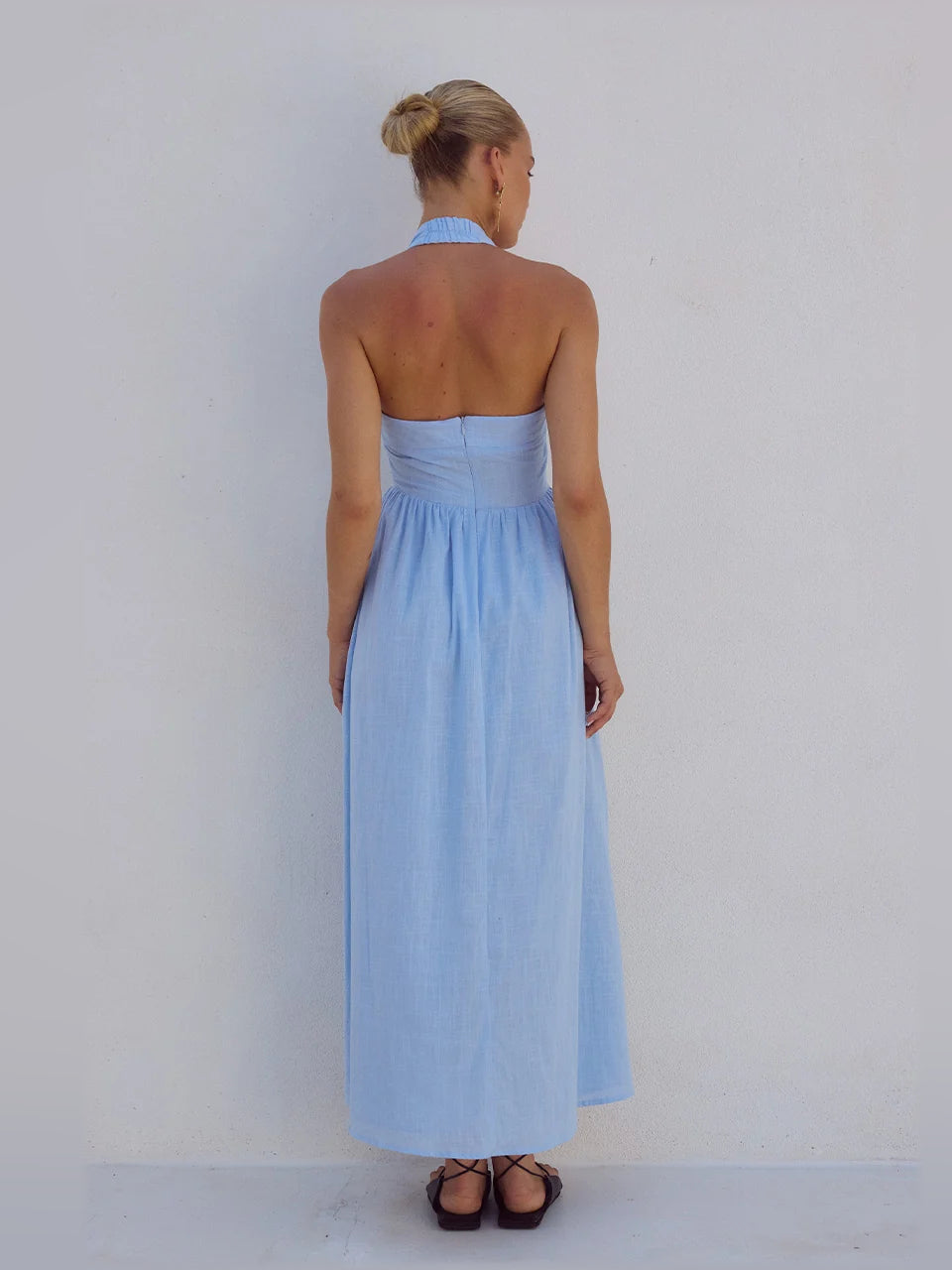 Ice blue midi formal dress back view with halter straps and cinched waist