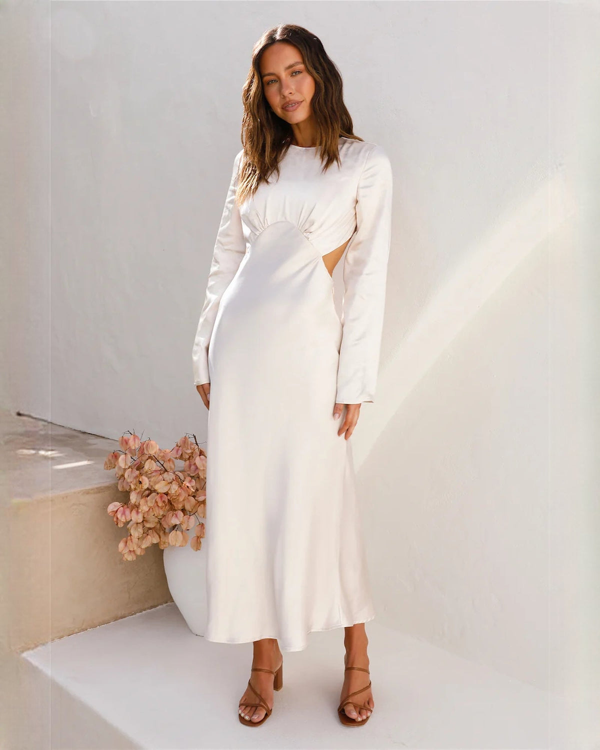 White satin A-line maxi dress with draped bodice and long sleeves