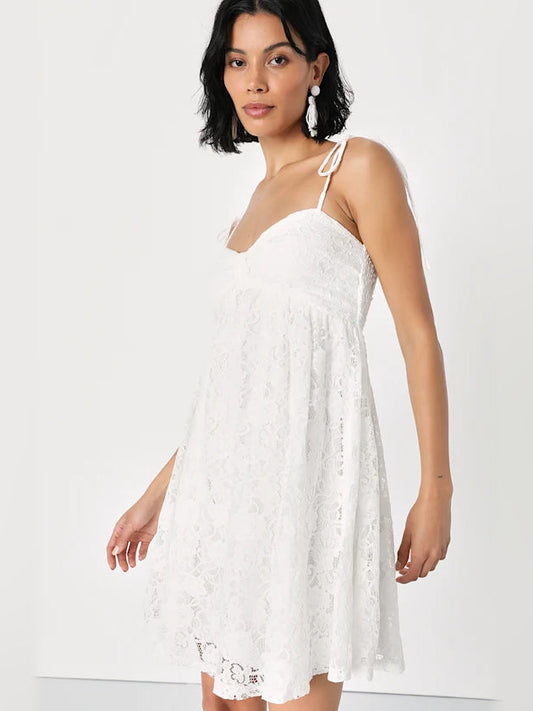 White lace A-line mini dress with sweetheart bodice and thin tie shoulder straps.