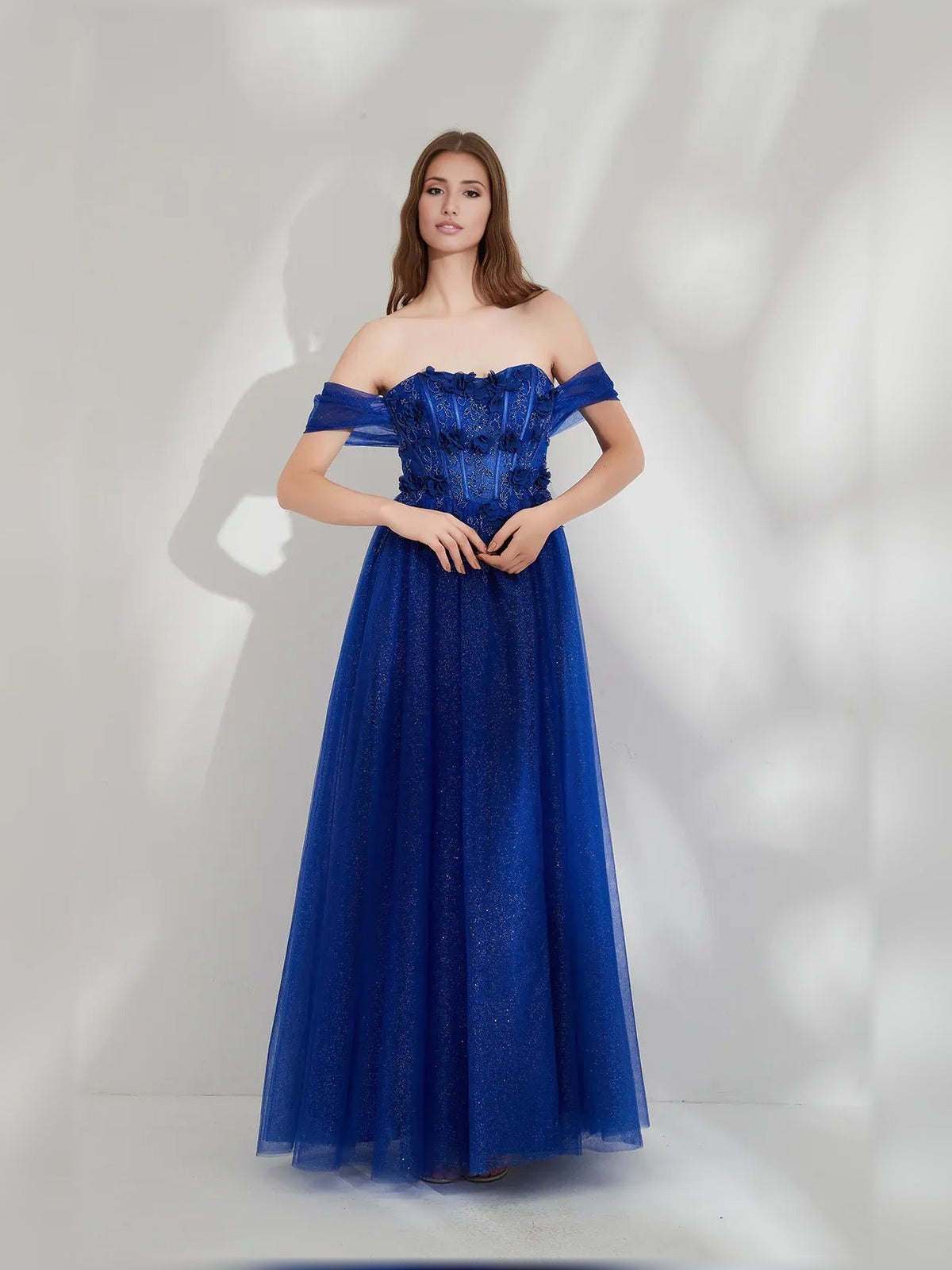 Dark blue off-shoulder floor-length formal dress with smocked bodice and ruffled sleeves