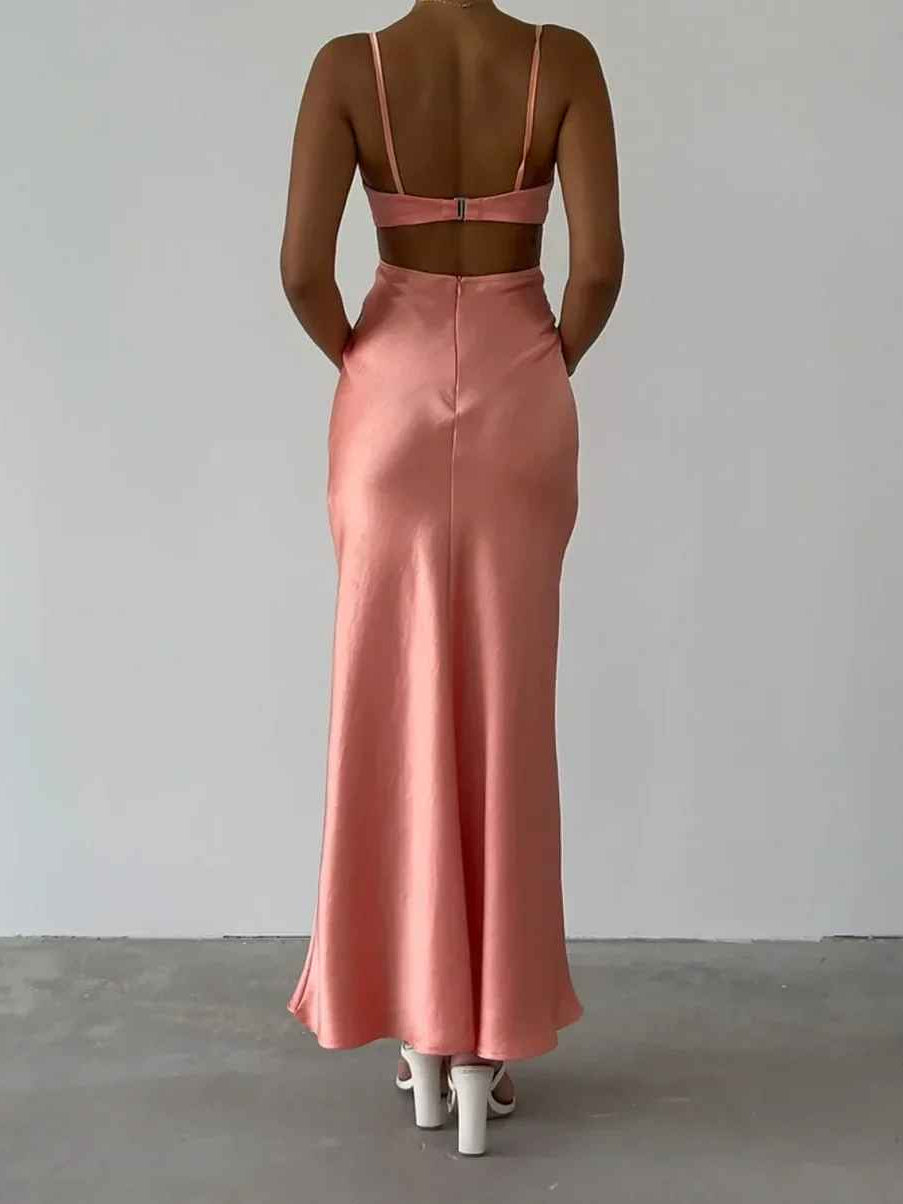 Pink satin maxi dress with open back and thin spaghetti straps; floor-length silhouette