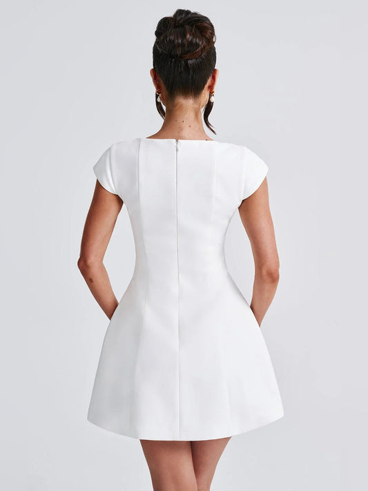 Ivory back view of A-line mini dress with center seam and cap sleeves