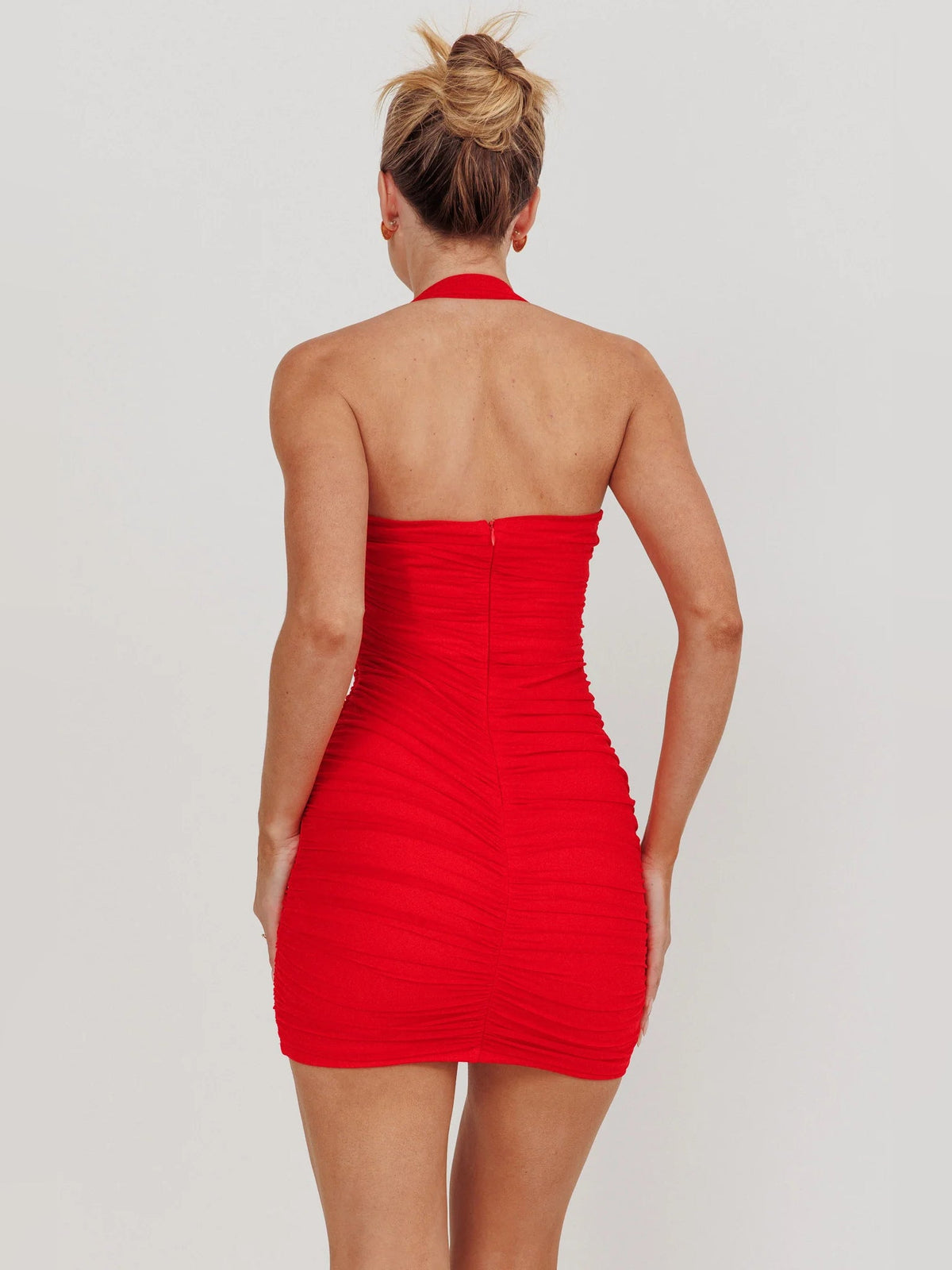 Red draped mini halter dress, open back with vertical seam detail