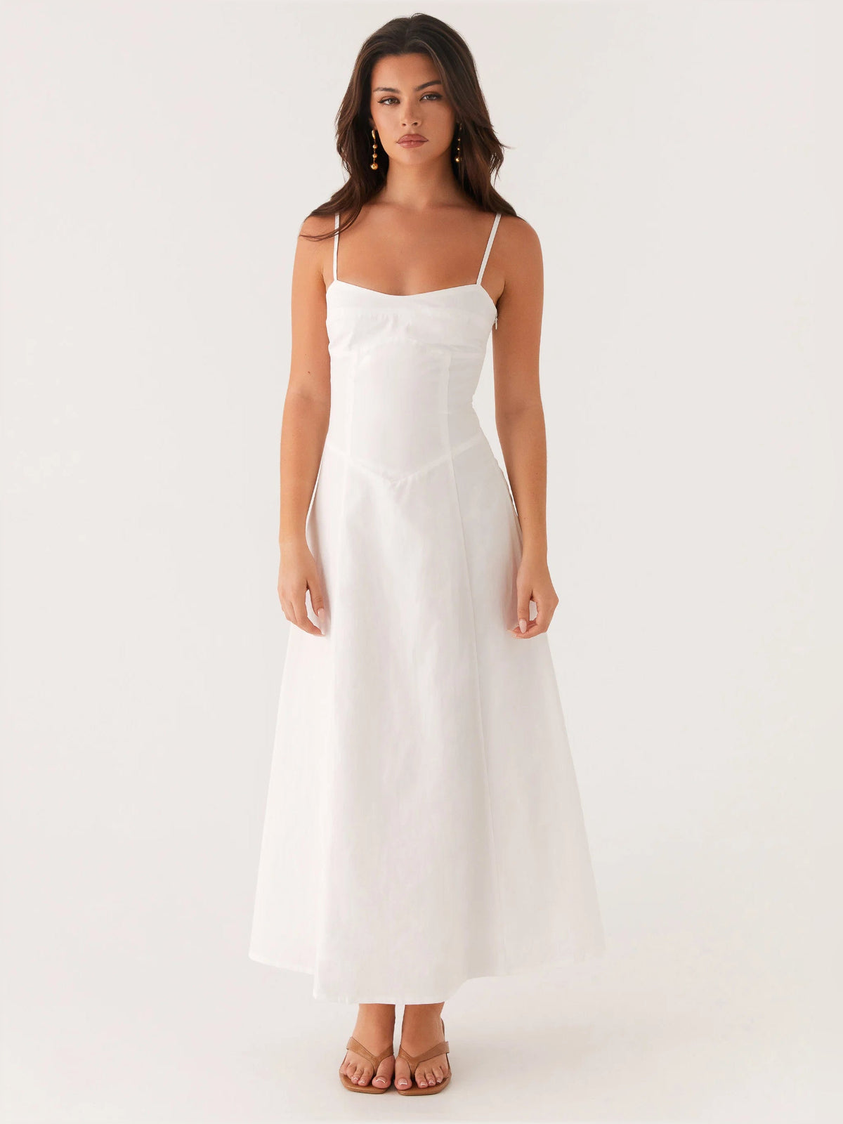 White midi formal dress with spaghetti straps and fitted skirt, front full-length view