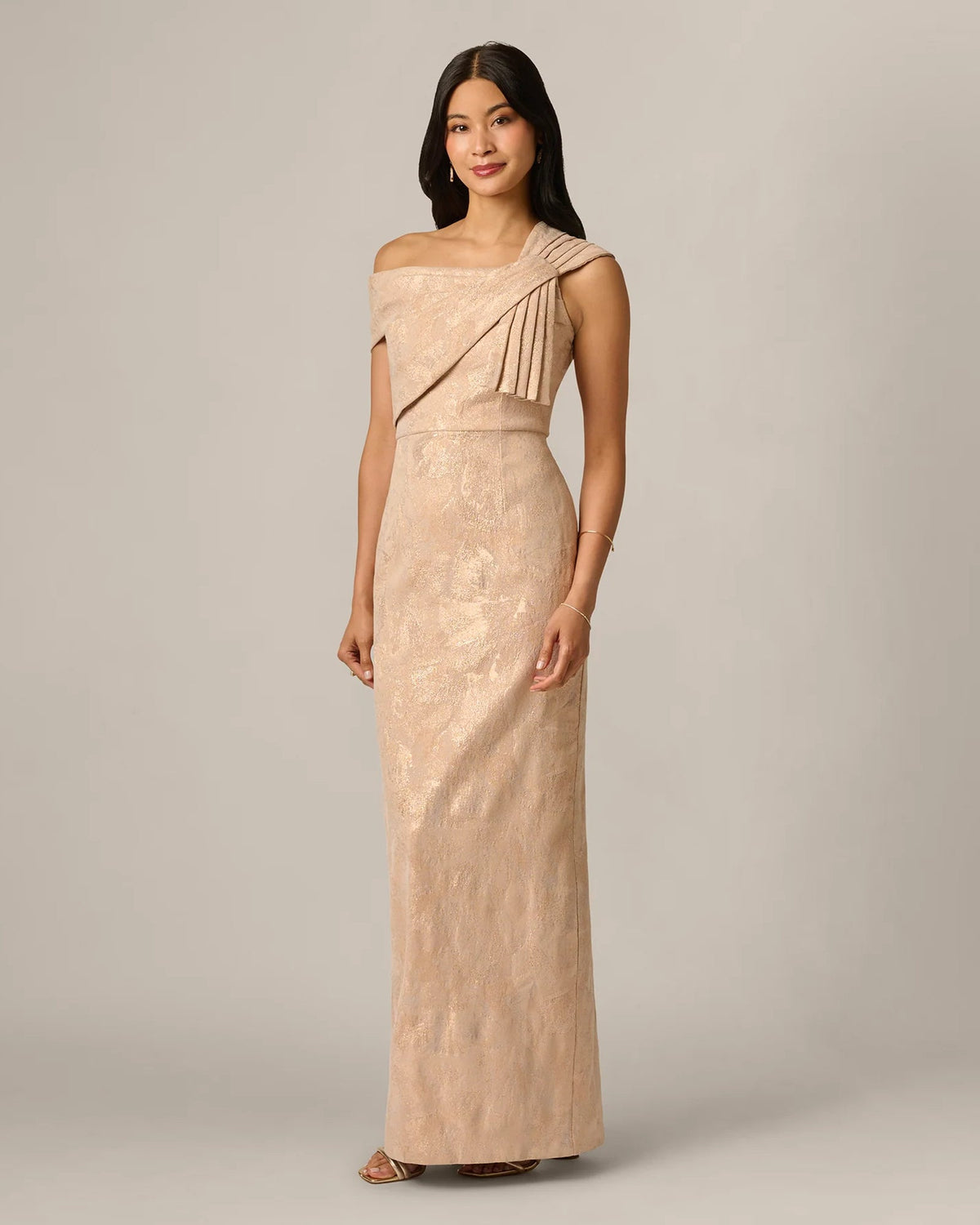 Champagne shimmer sheath maxi dress with draped one-shoulder bow detail