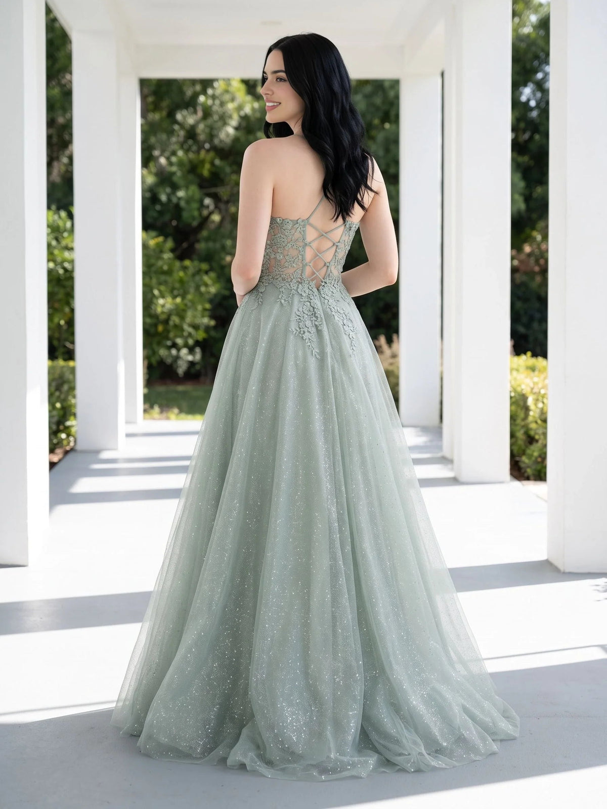 Sage green glitter tulle prom dress with open back detail and A-line maxi skirt