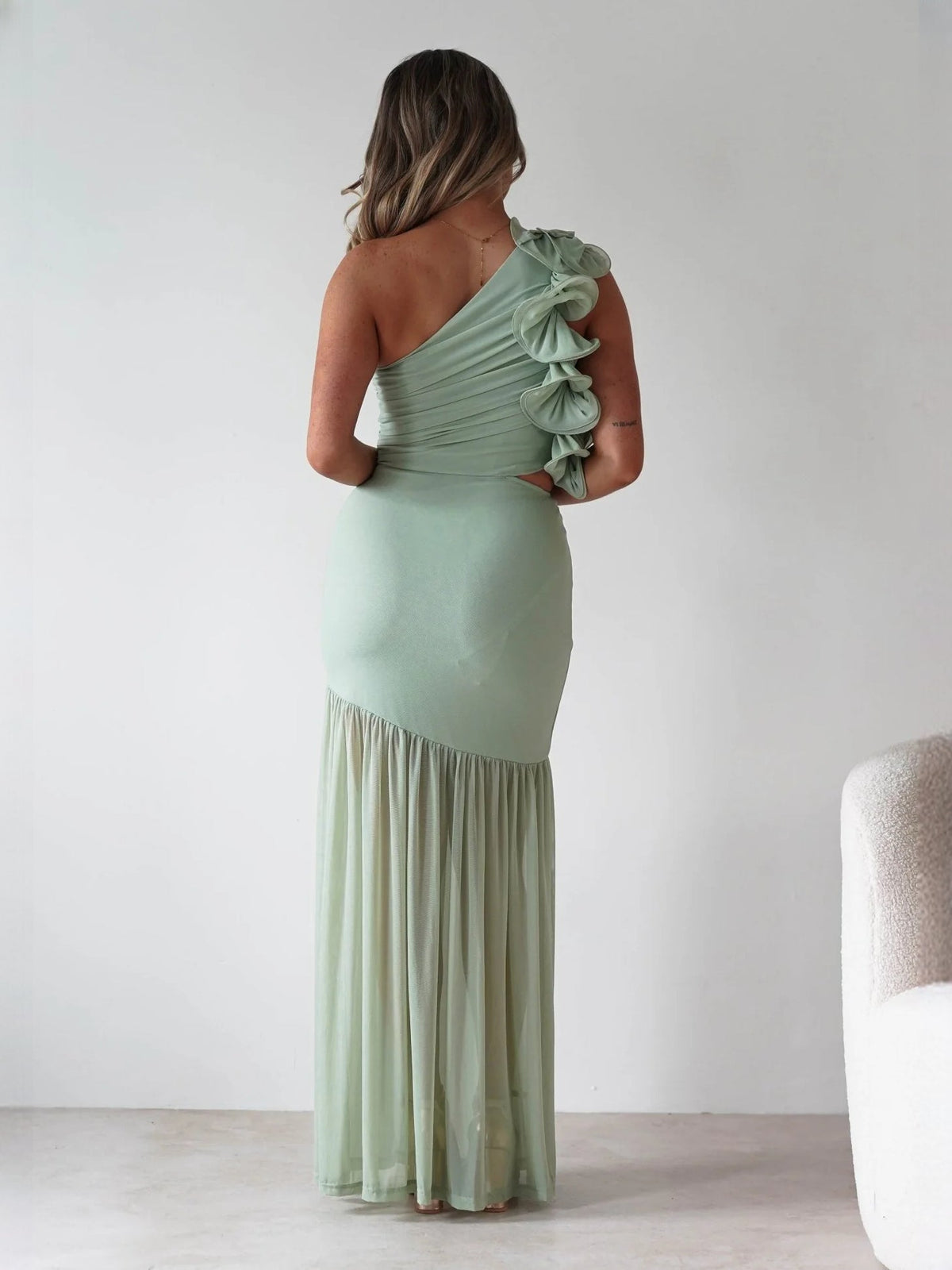 Sage fit-and-flare maxi formal dress with pleated skirt, full-length back view
