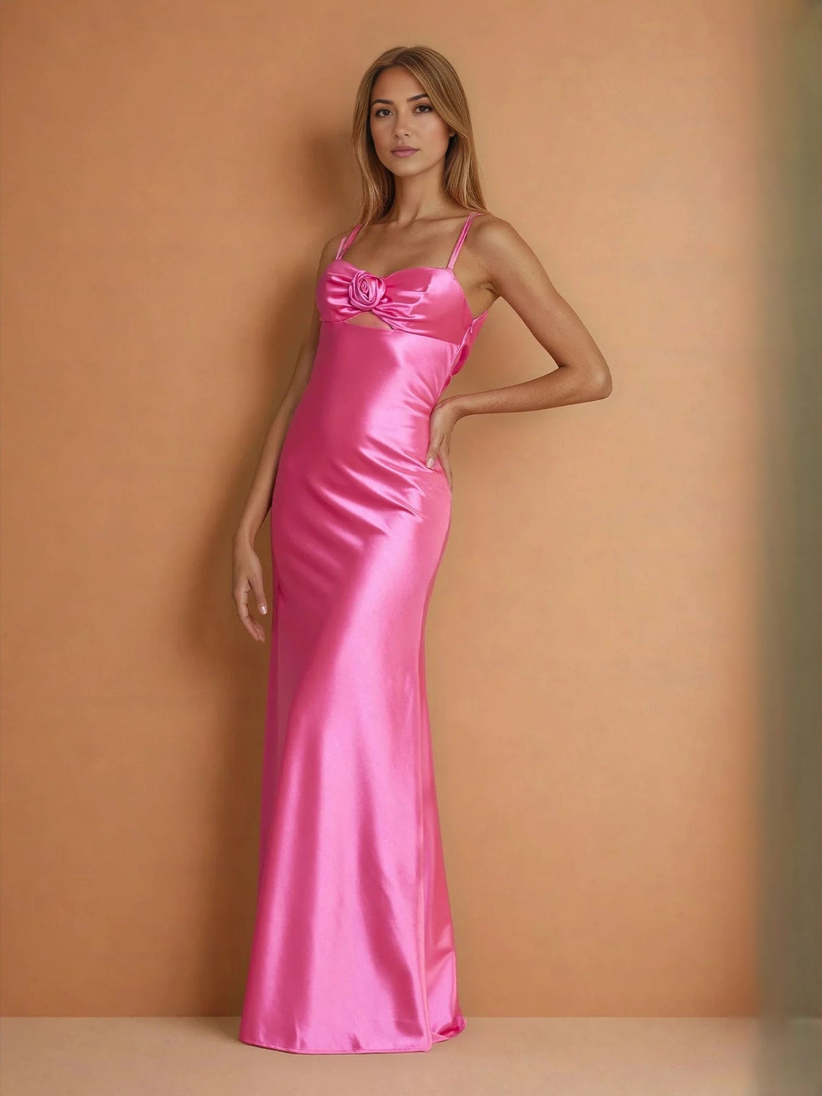 Hot pink satin mermaid prom dress with sweetheart neckline and rosette bust detail