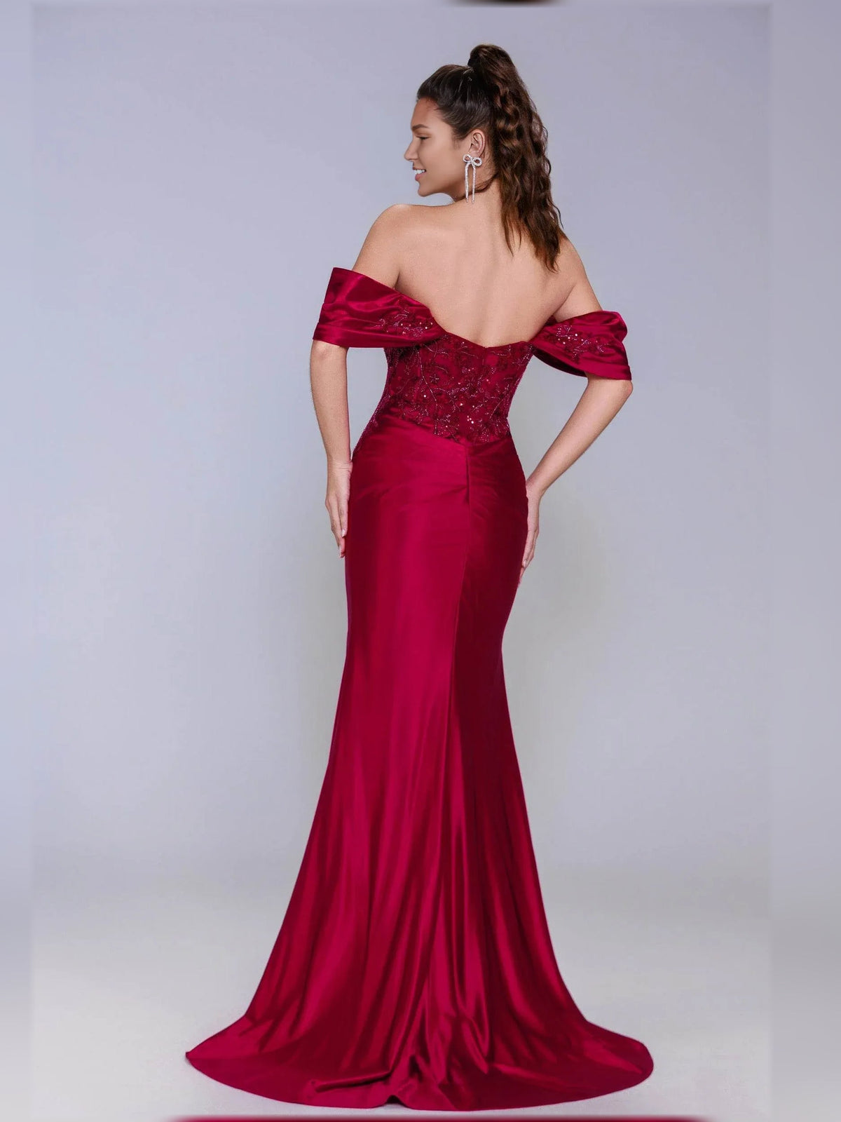 Deep red off-shoulder formal dress with ruched sweetheart bodice and long mermaid skirt.