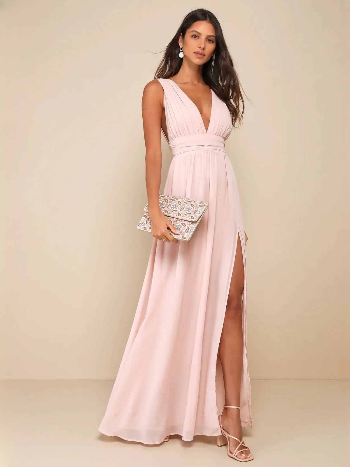 Light pink sleeveless V-neck A-line maxi dress with ruched waist and side slit