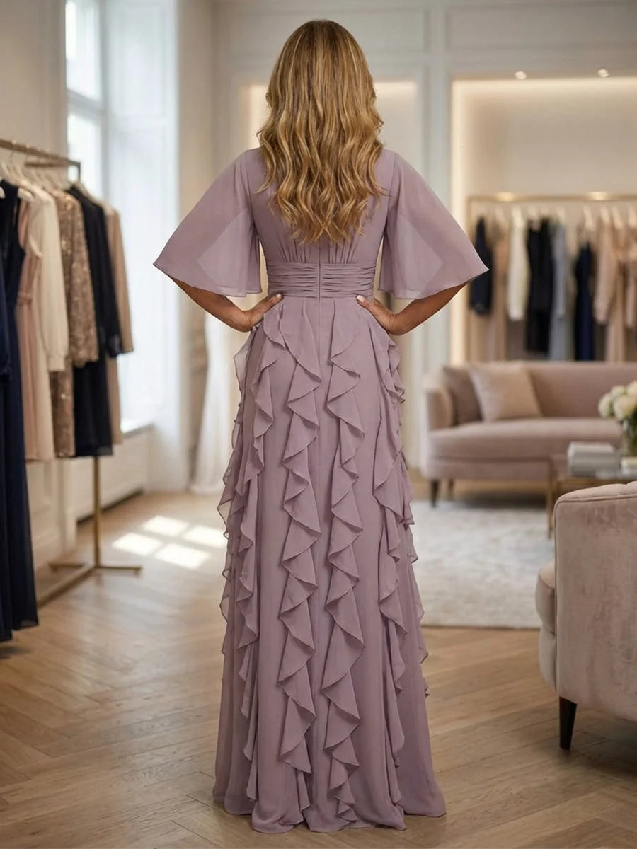 Back view mauve chiffon A-line dress with flutter sleeves and layered ruffle skirt
