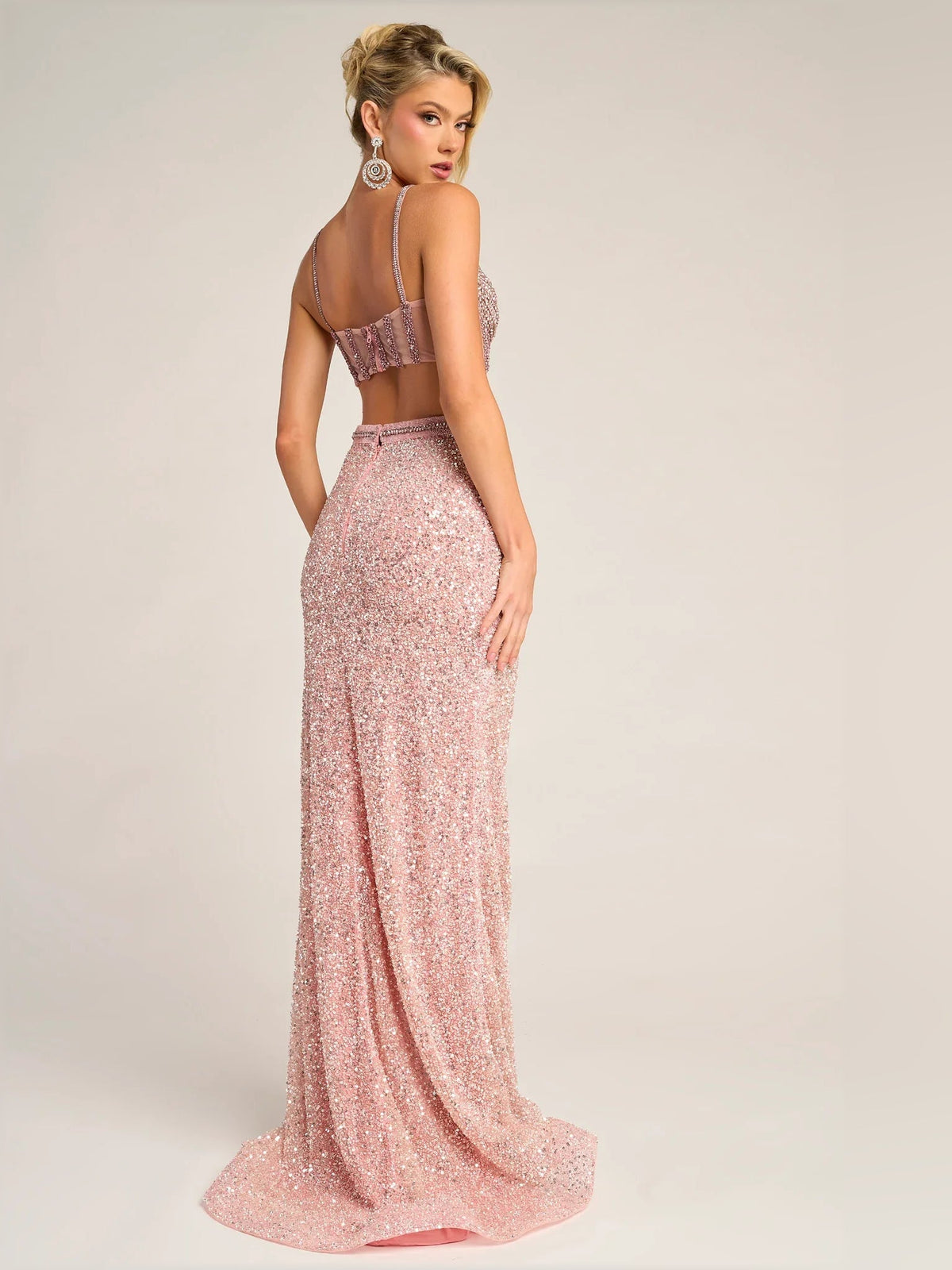 Coral pink sequin two-piece formal dress, side view, slit maxi skirt and beaded crop top