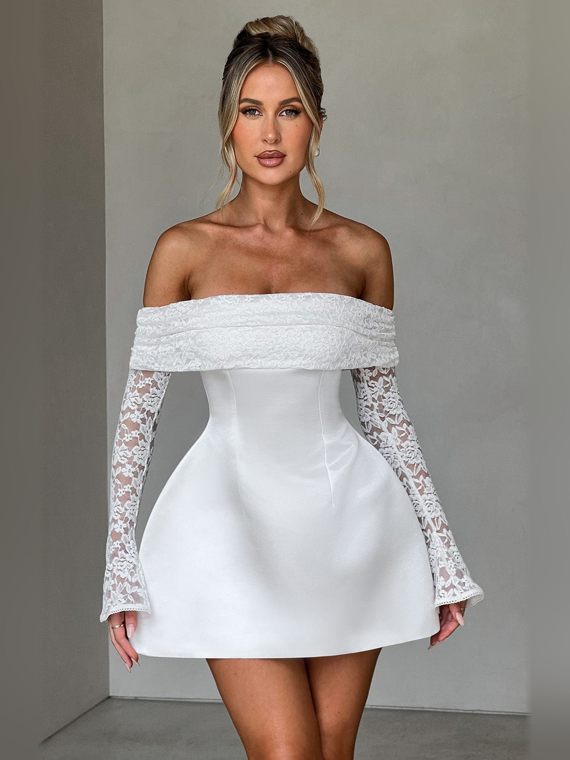 Ivory off-shoulder mini dress with lace sleeves and smooth fitted bodice, front view