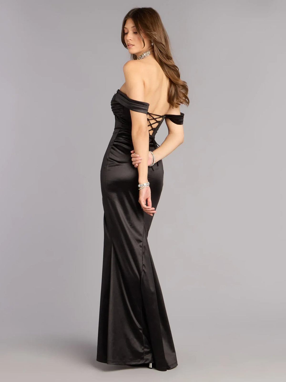 Black off-shoulder corset gown with rhinestone neckline, lace-up back, long slit