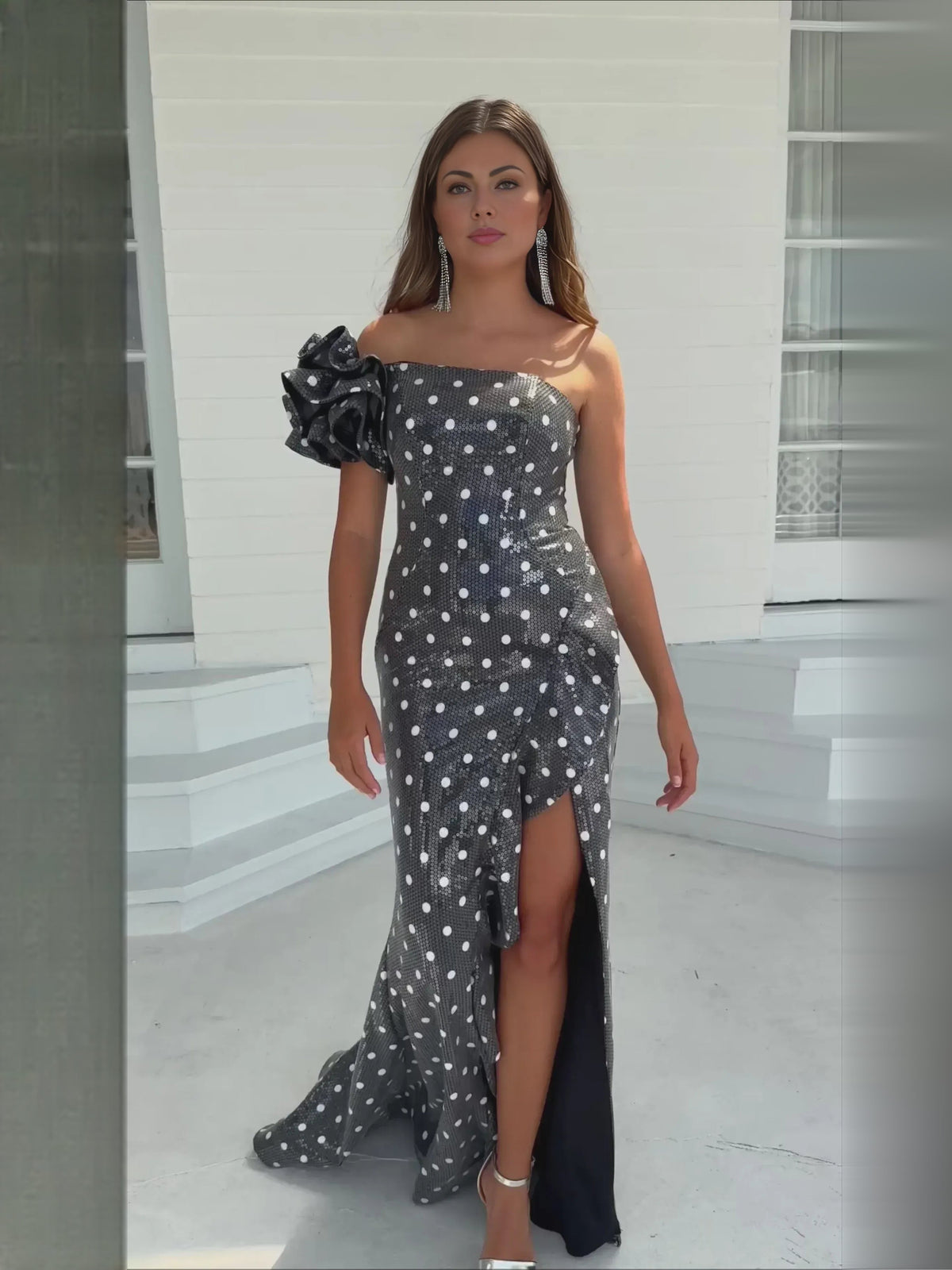 Black polka dot floor-length one-shoulder dress with ruffle detail and front slit