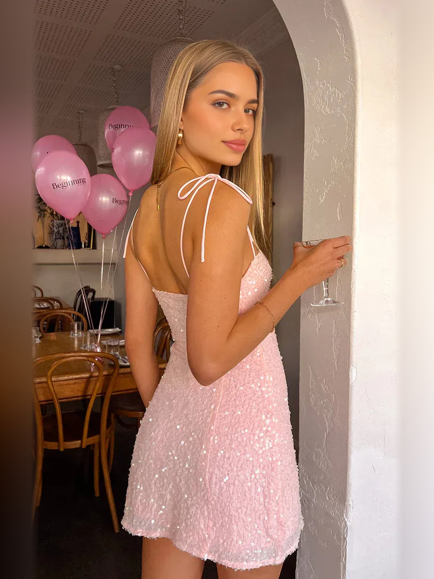 Light pink sequin bodycon mini dress with sweetheart neckline and tie-back spaghetti straps