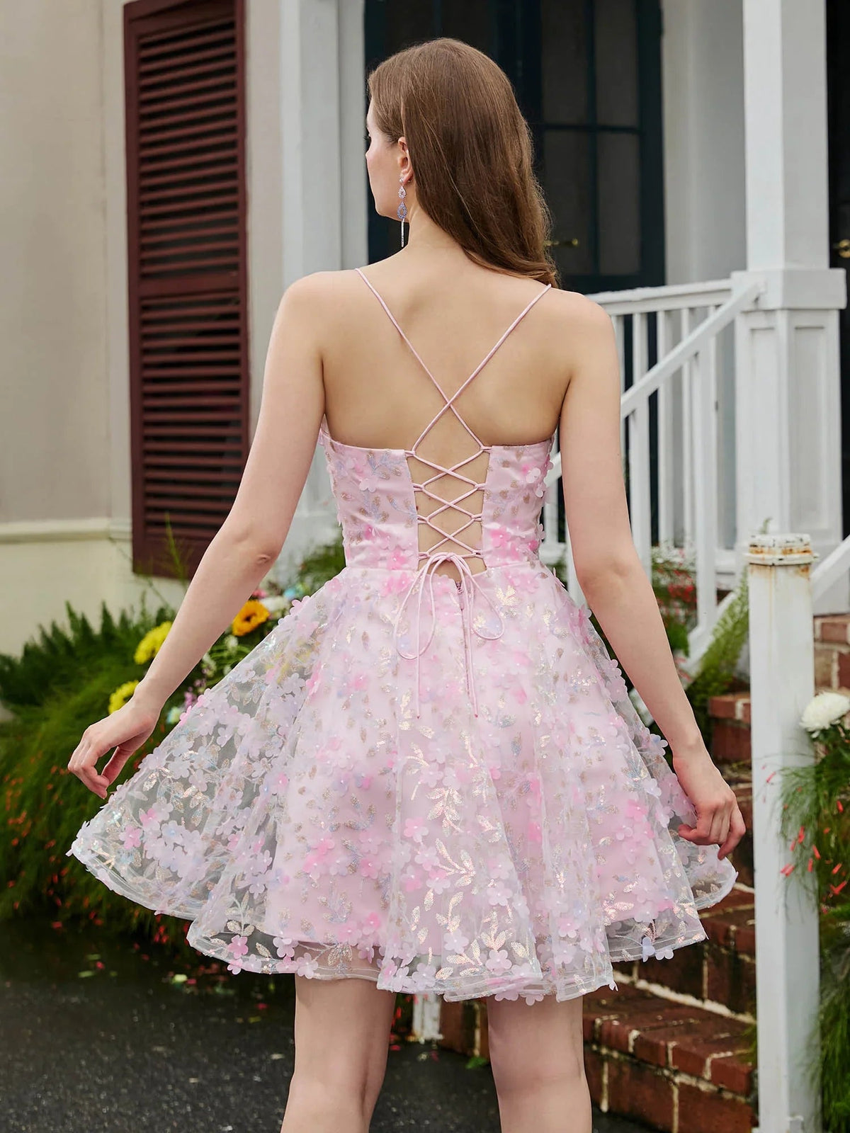 Blush pink A-line mini tulle dress with crisscross open back and floral applique