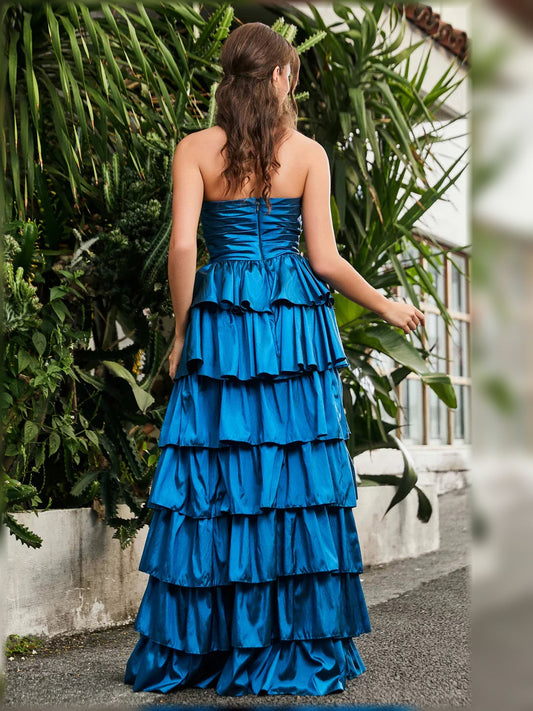 Blue strapless tiered formal dress from the back with layered ruffle skirt