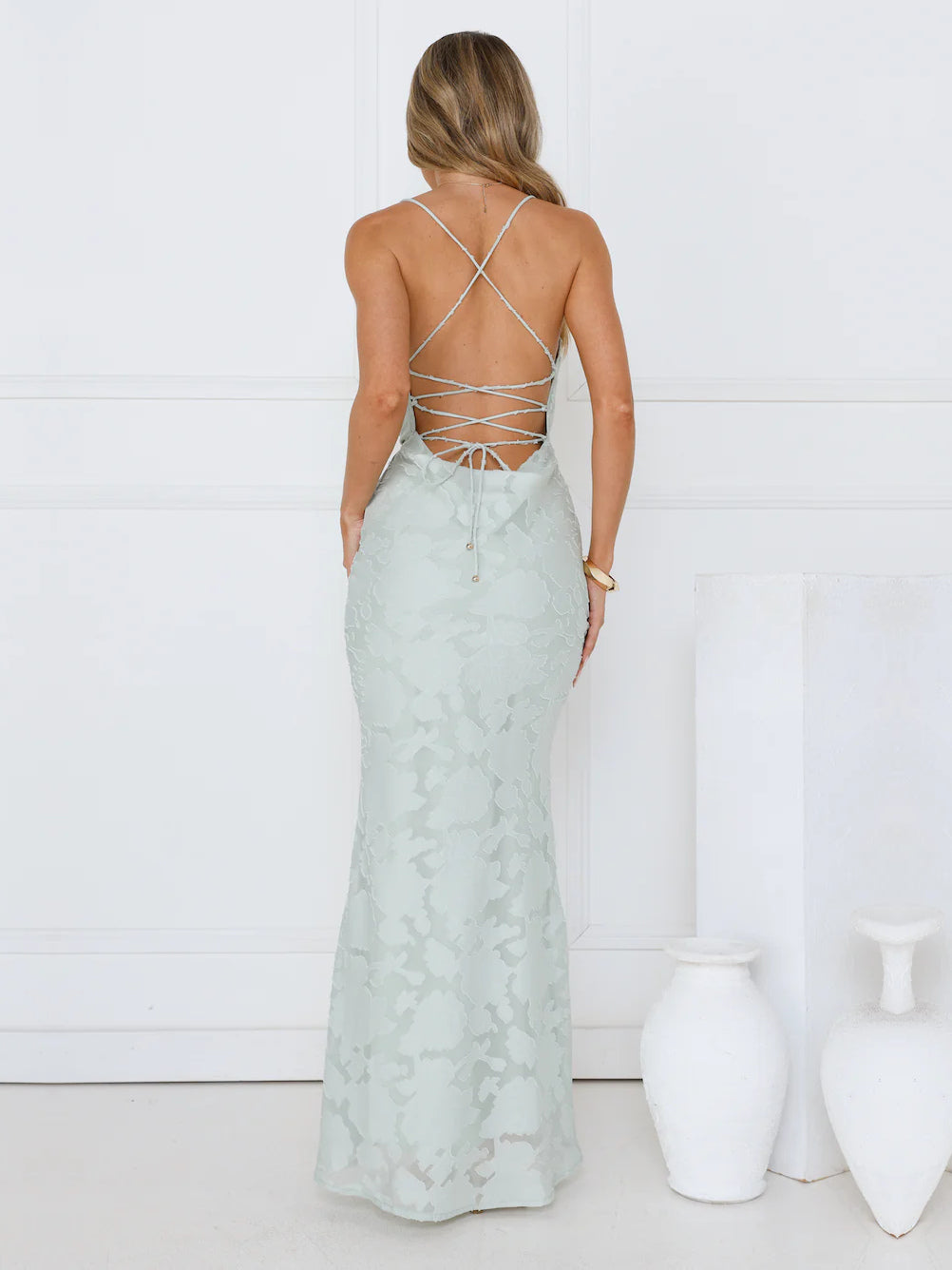 Sage mermaid maxi formal dress with lace-up back, full-length back view