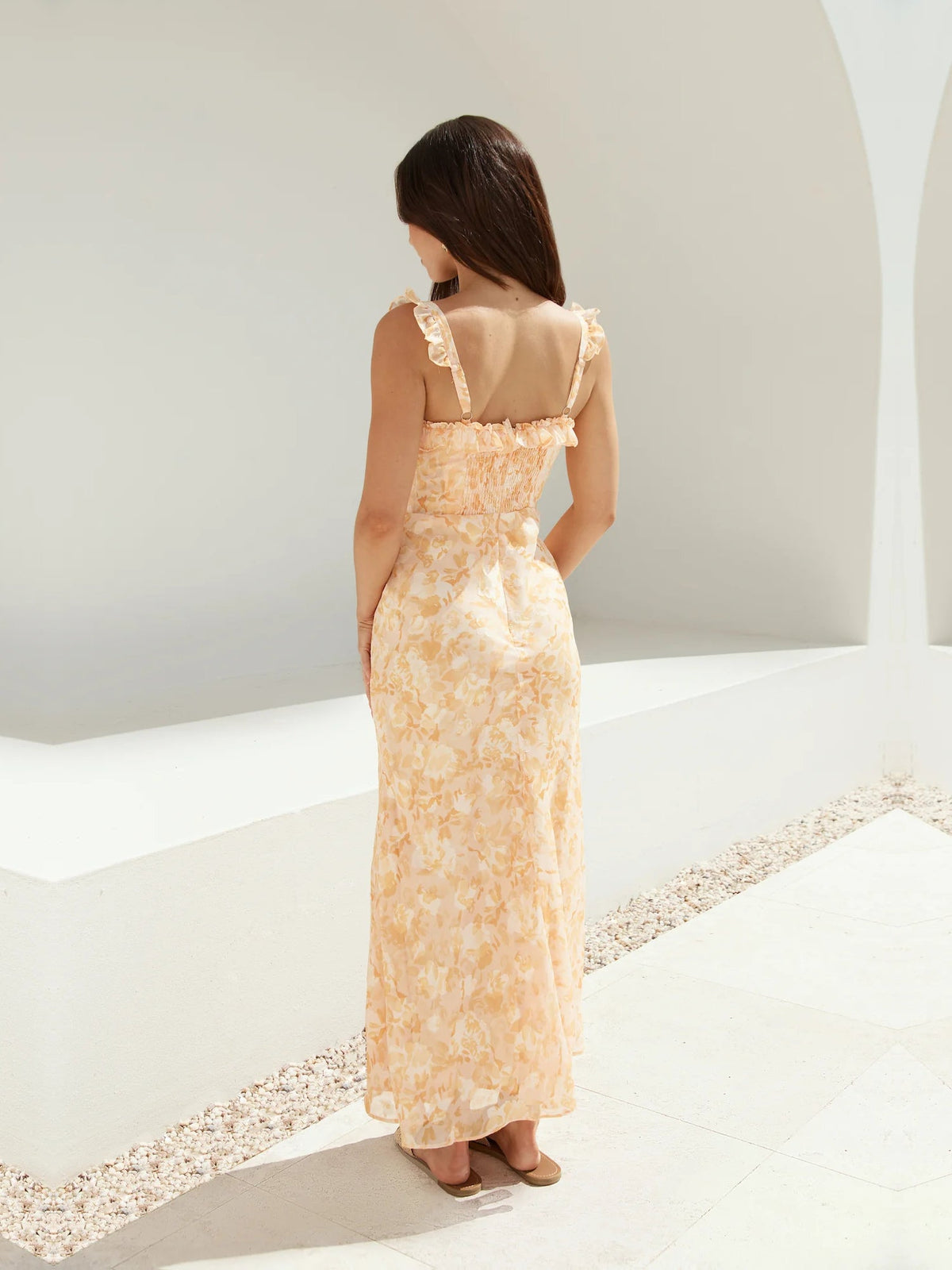 Orange sheath maxi formal dress with floral print, full-length back view