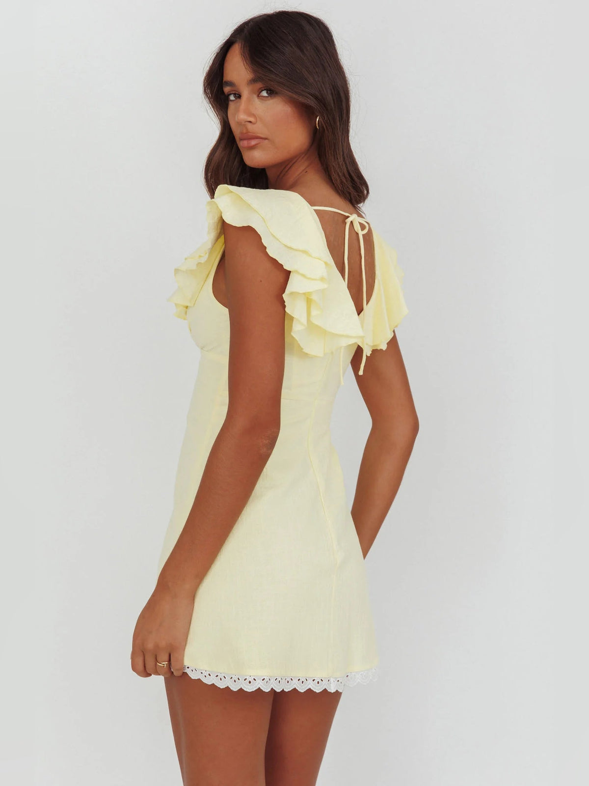 Butter layered ruffled mini dress with back tie detail and lace-trim hem