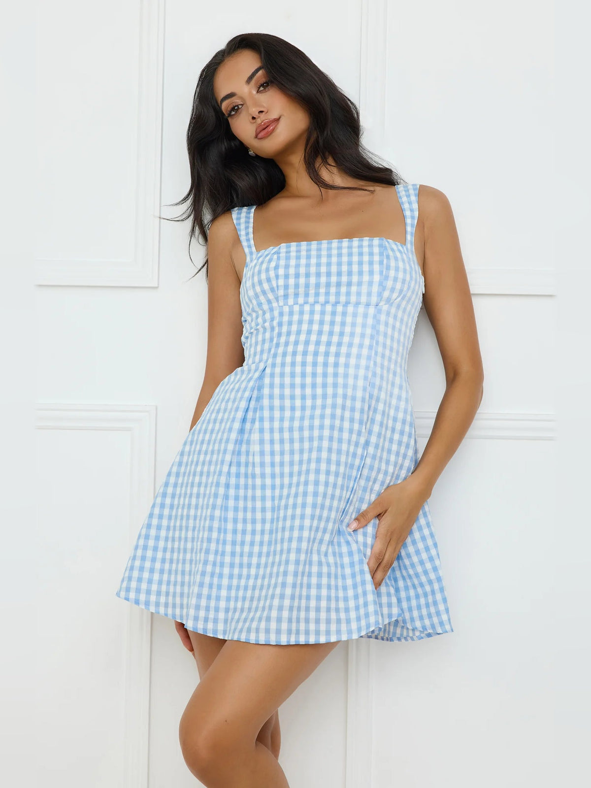 Light blue gingham mini dress with square neckline, thin straps, and flared skirt